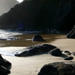 cropped-wet-beach-and-rocks.jpg